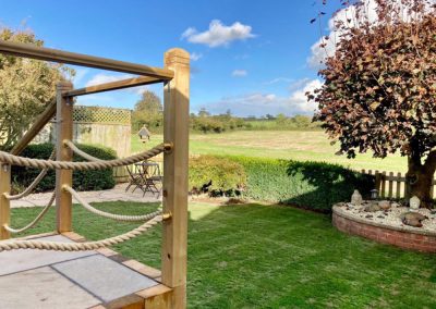 Paving slab steps and wooden rail