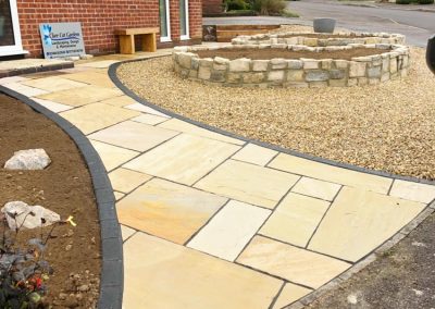 Paving and Yin and Yang flower beds