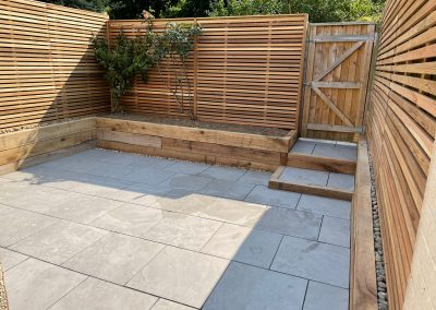 Fence and paving in a small garden