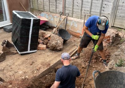 Hard work taking place landscaping a small garden